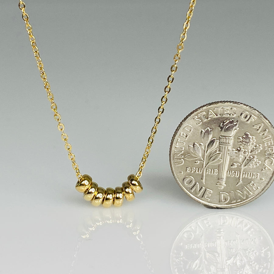 7 Wishes Gold Barrel Necklace