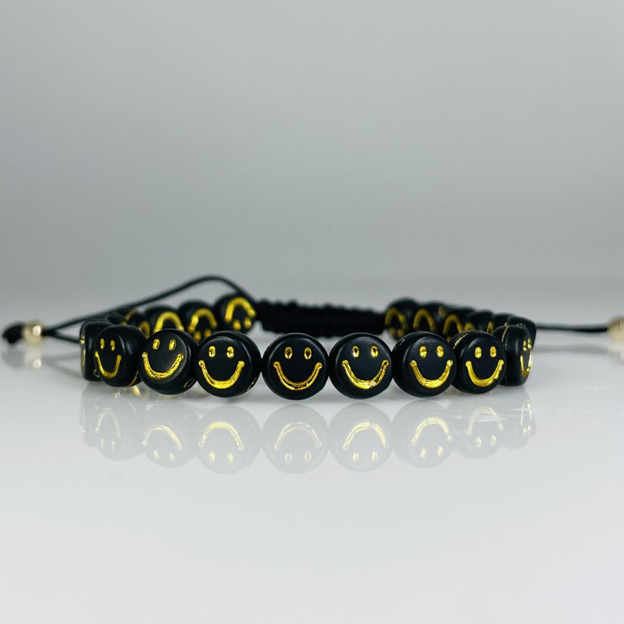 Black Clay Beaded Bracelet with Black and Gold Happy Face Charm